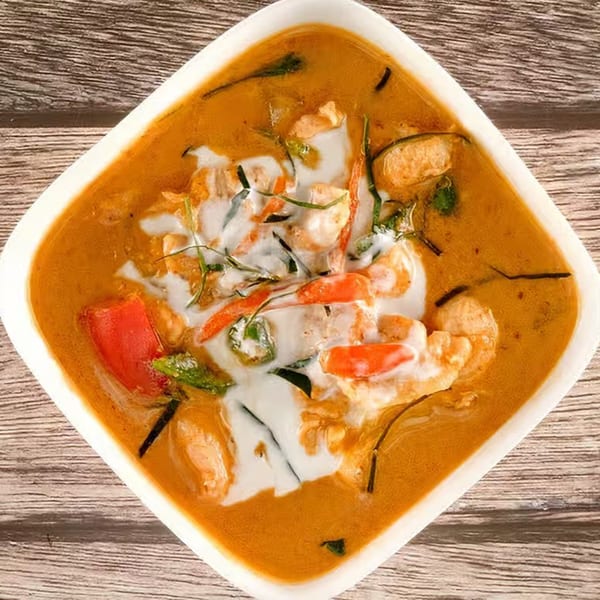 Tasty Thai Tampa's red curry with shrimp, red peppers, and coconut milk swirl.